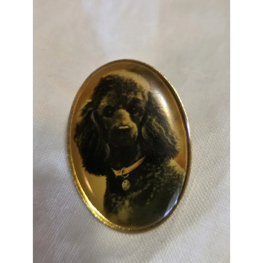 vintage Otter House lapel pin featuring a portrait of a black poodle